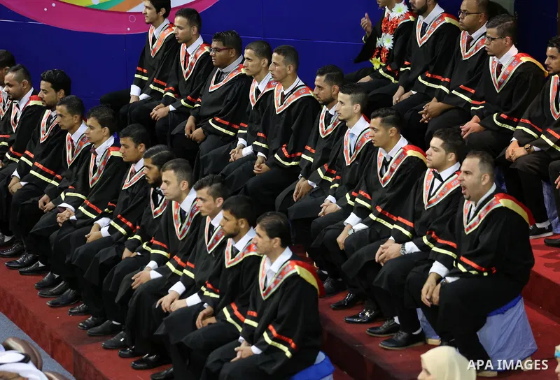 Palestinian deaf students participate in their first graduation ceremony at the Islamic University in Gaza city on August 7, 2016. Photo by Mohammed Asad