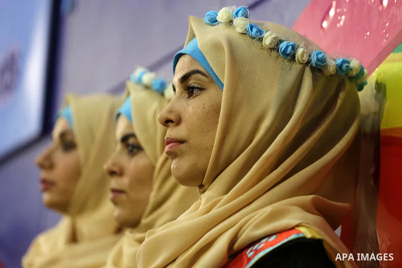 Palestinian deaf students participate in their first graduation ceremony at the Islamic University in Gaza city on August 7, 2016. Photo by Mohammed Asad