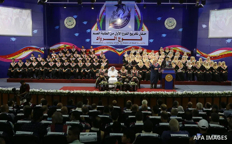 Palestinian deaf students participate in their first graduation ceremony at the Islamic University in Gaza city on August 7, 2016. Photo by Mohammed Asad