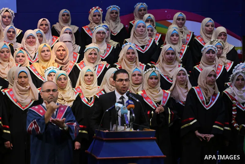 Palestinian deaf students participate in their first graduation ceremony at the Islamic University in Gaza city on August 7, 2016. Photo by Mohammed Asad