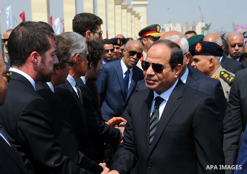 Egyptian President Abdel Fattah al-Sisi comforts relatives of Egyptian-American Ahmed Zewail world's Nobel Prize in chemistry, who died last Tuesday for 70 years in the United States during a military funeral ceremony at...