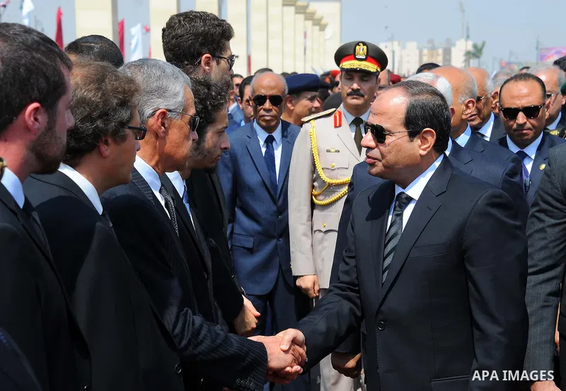 Egyptian President Abdel Fattah al-Sisi comforts relatives of Egyptian-American Ahmed Zewail world's Nobel Prize in chemistry, who died last Tuesday for 70 years in the United States during a military funeral ceremony at...