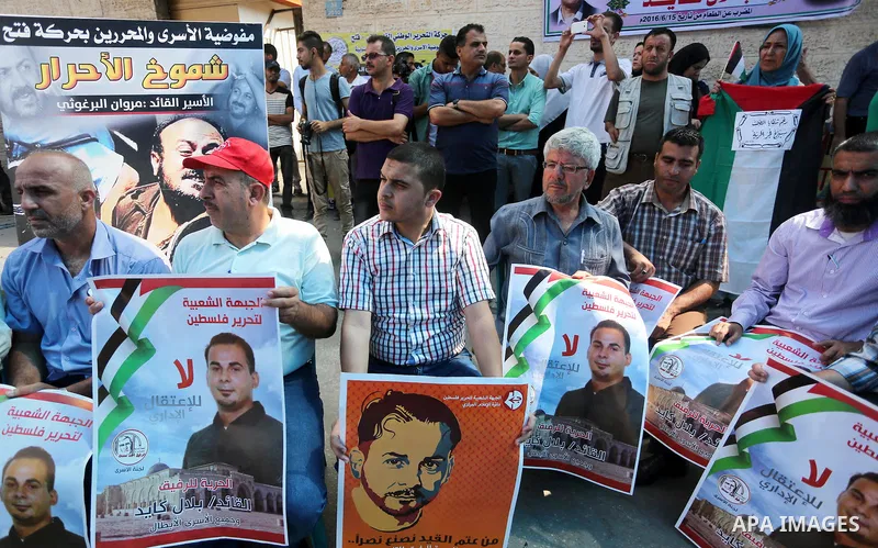 Supporters of the Popular Front for the Liberation of Palestine (PFLP) take part in a protest demanding for the release of Bilal Kayed a Palestinian prisoner on hunger strike, in front of Red cross office, in Gaza city o...