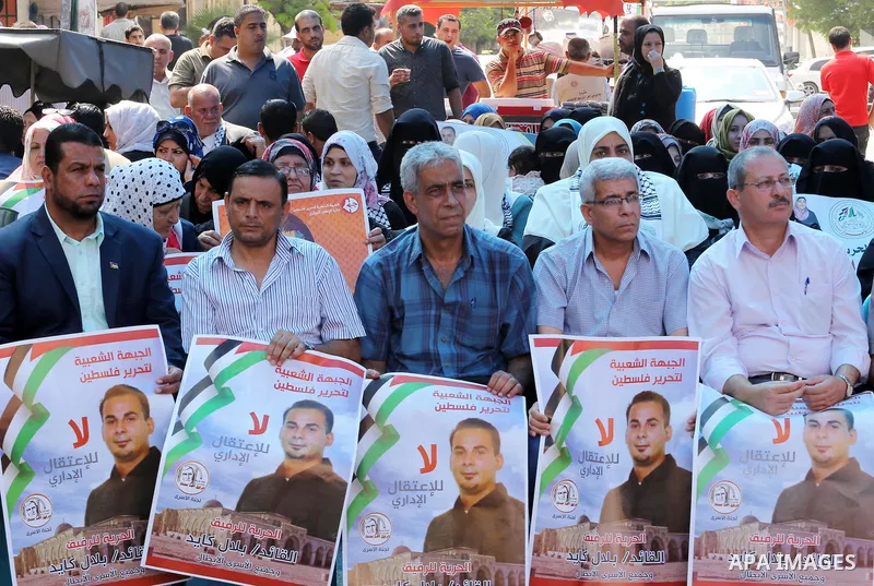 Supporters of the Popular Front for the Liberation of Palestine (PFLP) take part in a protest demanding for the release of Bilal Kayed a Palestinian prisoner on hunger strike, in front of Red cross office, in Gaza city o...