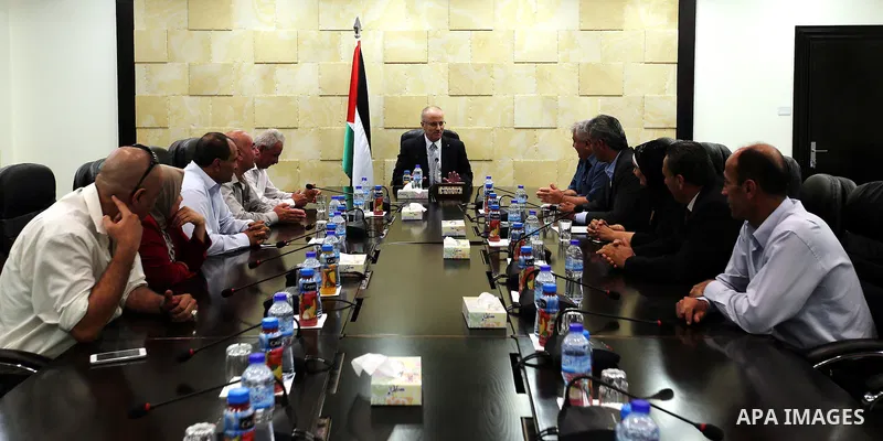 Palestinian Prime Minister, Rami Hamadallah,meets with Fatah members in Jenin province, in the West Bank city of Ramallah, on Aug 8, 2016. Photo by Prime Minister Office