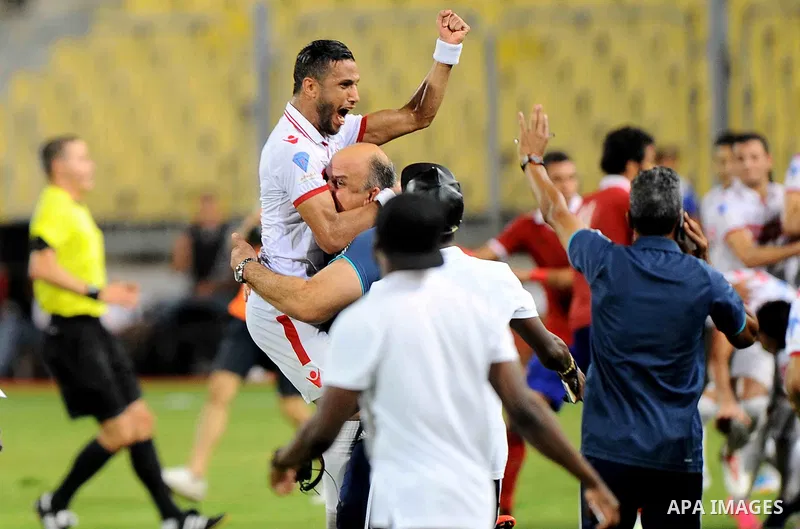 Zamalek players celebrate with the trophy after winning their Egyptian Cup finals derby soccer match against Al Ahly in Borg El-Arab Stadium near Alexandria, Egypt, Aug 8,2016. Photo by Stringer