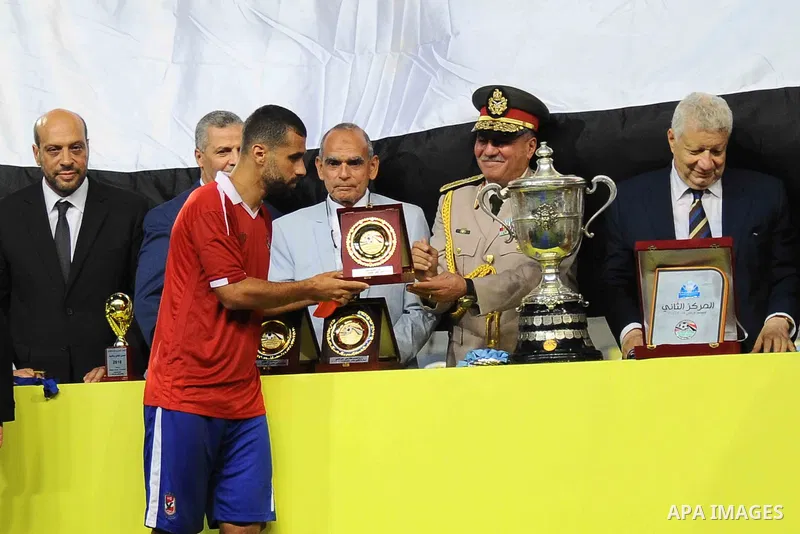 Zamalek players celebrate with the trophy after winning their Egyptian Cup finals derby soccer match against Al Ahly in Borg El-Arab Stadium near Alexandria, Egypt, Aug 8,2016. Photo by Stringer