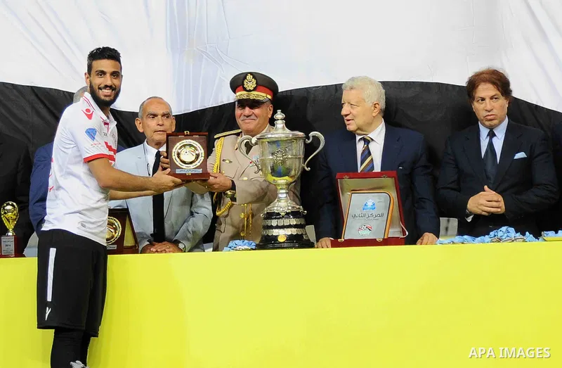 Zamalek players celebrate with the trophy after winning their Egyptian Cup finals derby soccer match against Al Ahly in Borg El-Arab Stadium near Alexandria, Egypt, Aug 8,2016. Photo by Stringer