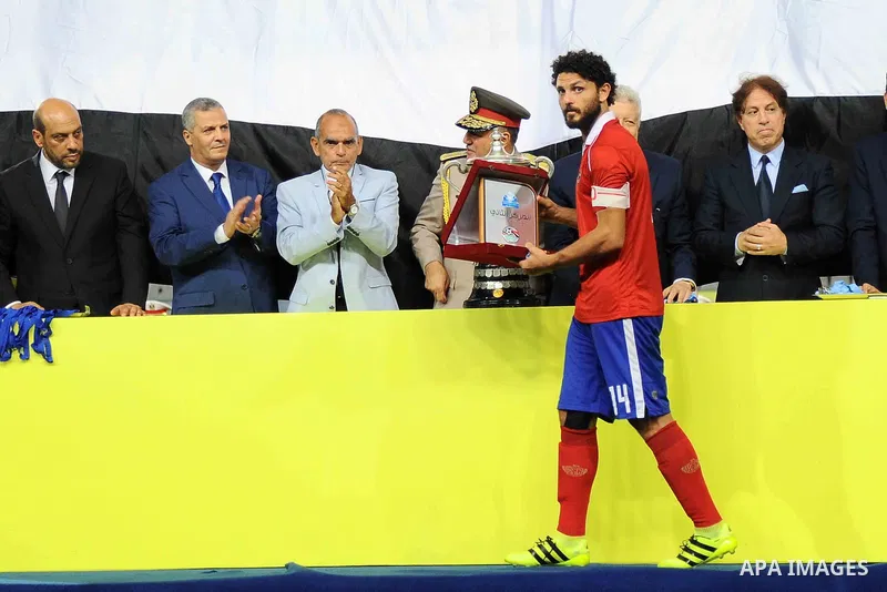 Zamalek players celebrate with the trophy after winning their Egyptian Cup finals derby soccer match against Al Ahly in Borg El-Arab Stadium near Alexandria, Egypt, Aug 8,2016. Photo by Stringer