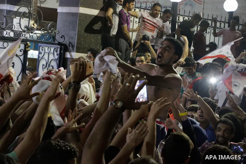 Fans of Zamalek football club celebrate winning the Egypt Cup after Egypt Cup final match against Al Ahli club in Borg El-Arab Stadium near Alexandria, Egypt, Aug 8,2016. Photo by Stringer