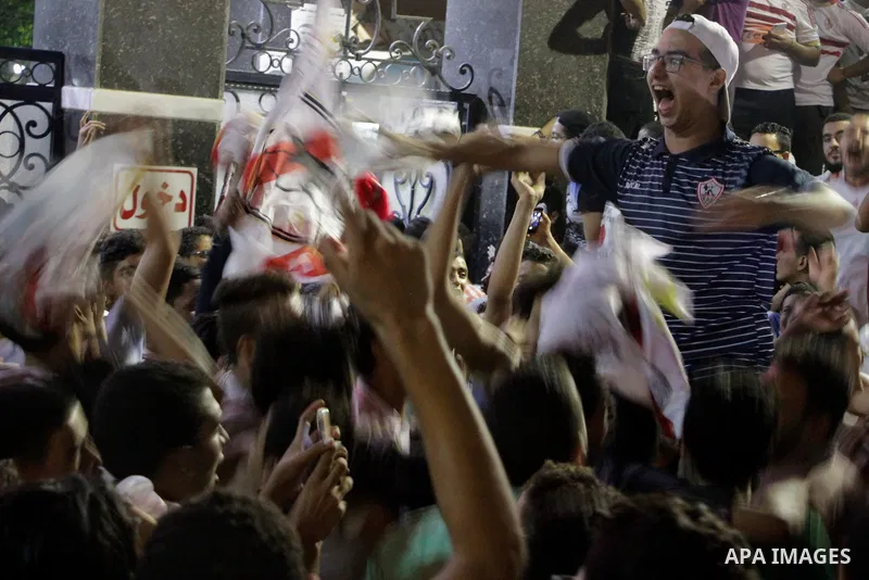 Fans of Zamalek football club celebrate winning the Egypt Cup after Egypt Cup final match against Al Ahli club in Borg El-Arab Stadium near Alexandria, Egypt, Aug 8,2016. Photo by Stringer