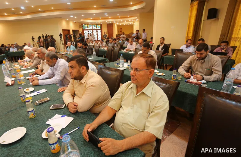 Members of Hamas legislative council attend a meeting in Gaza city, on Aug. 09, 2016. Photo by Mohammed Asad