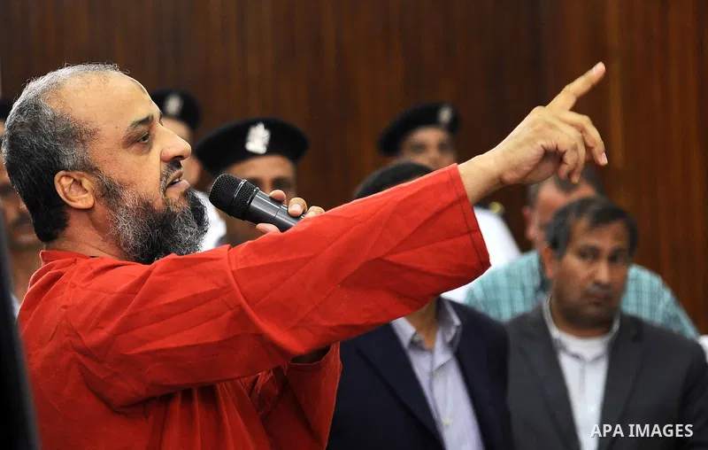 An Egyptian Muslim Brotherhood defendant speaks to judges during his trial in a case known in media as "Rabaa Operations Room", in Cairo, on Aug. 09, 2016. Photo by Amr Sayed