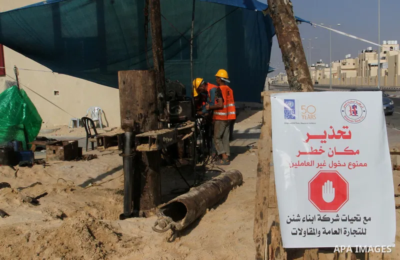 Palestinian workers work at project executed by the United Nations Development Programme (UNDP), in Rafah in the southern Gaza strip, on Aug. 09, 2016. Israel said it had arrested and charged a United Nations employee fo...