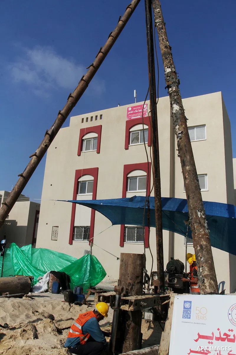 Palestinian workers work at project executed by the United Nations Development Programme (UNDP), in Rafah in the southern Gaza strip, on Aug. 09, 2016. Israel said it had arrested and charged a United Nations employee fo...