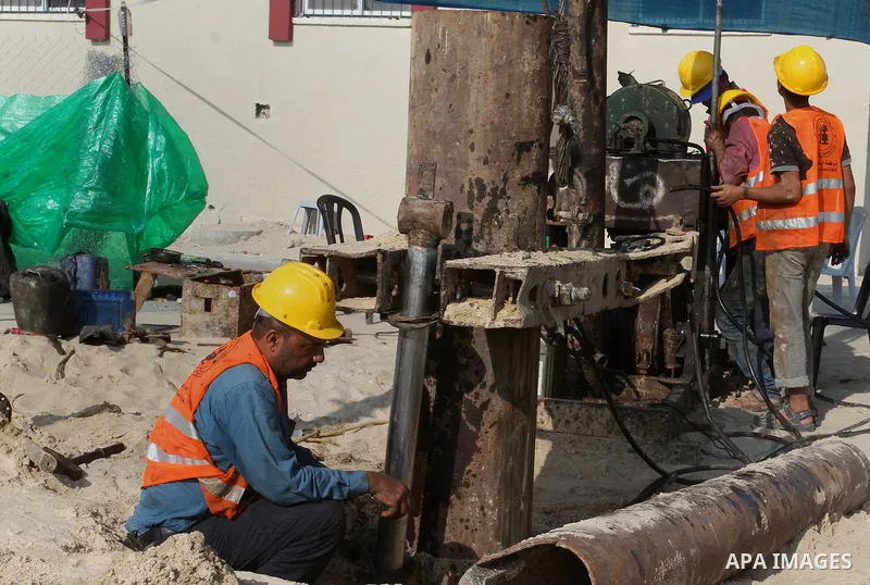 Palestinian workers work at project executed by the United Nations Development Programme (UNDP), in Rafah in the southern Gaza strip, on Aug. 09, 2016. Israel said it had arrested and charged a United Nations employee fo...