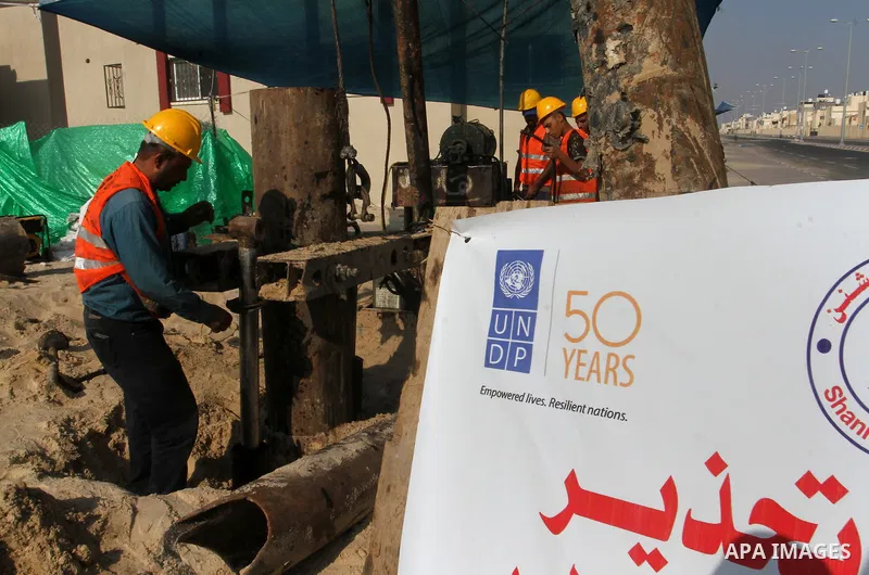 Palestinian workers work at project executed by the United Nations Development Programme (UNDP), in Rafah in the southern Gaza strip, on Aug. 09, 2016. Israel said it had arrested and charged a United Nations employee fo...
