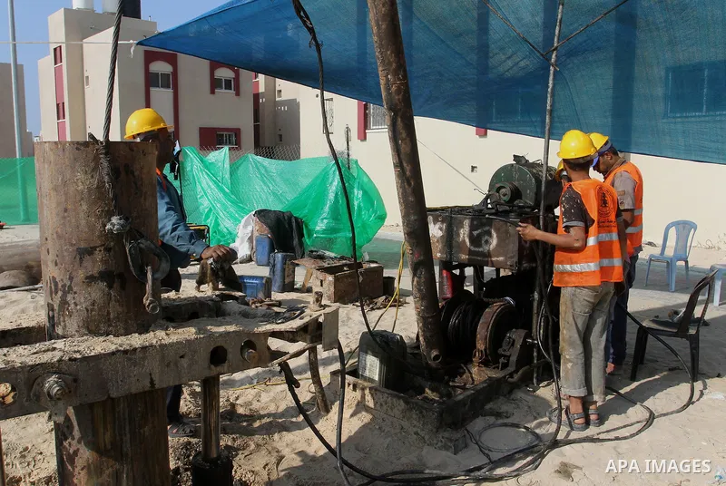 Palestinian workers work at project executed by the United Nations Development Programme (UNDP), in Rafah in the southern Gaza strip, on Aug. 09, 2016. Israel said it had arrested and charged a United Nations employee fo...