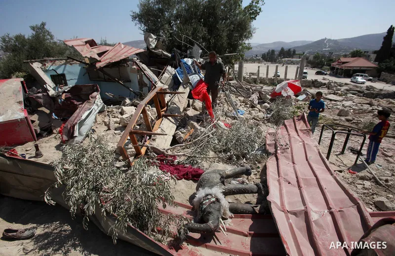 A Palestinian inspects the rubble of his restaurant after it was demolished by Israeli troops in the village of Sabastya near the West Bank city of Nablus, on Aug. 9, 2016. Israeli authorities demolished a restaurant and...