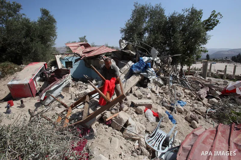 A Palestinian inspects the rubble of his restaurant after it was demolished by Israeli troops in the village of Sabastya near the West Bank city of Nablus, on Aug. 9, 2016. Israeli authorities demolished a restaurant and...