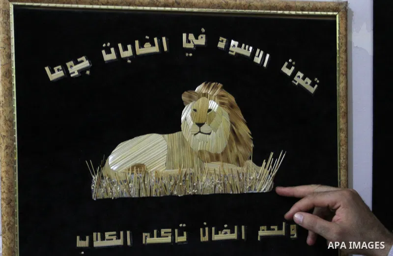 A painting from straw is displayed, in Rafah in the southern Gaza strip, on August 10, 2016. Photo by Abed Rahim Khatib