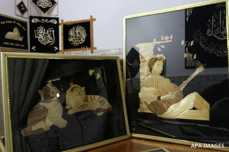 A painting from straw is displayed, in Rafah in the southern Gaza strip, on August 10, 2016. Photo by Abed Rahim Khatib