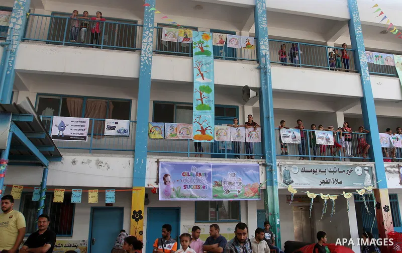 Palestinian schoolgirls take part in the closing ceremony of 2016 summer fun week organised by the United Nations Relief and Works Agency (UNRWA), in Rafah in the southern Gaza strip, on August 10, 2016. Photo by Abed Ra...