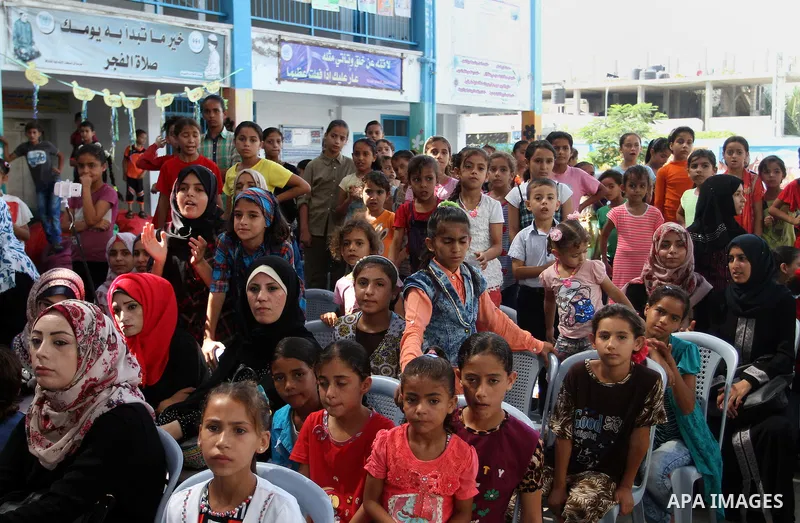 Palestinian schoolgirls take part in the closing ceremony of 2016 summer fun week organised by the United Nations Relief and Works Agency (UNRWA), in Rafah in the southern Gaza strip, on August 10, 2016. Photo by Abed Ra...