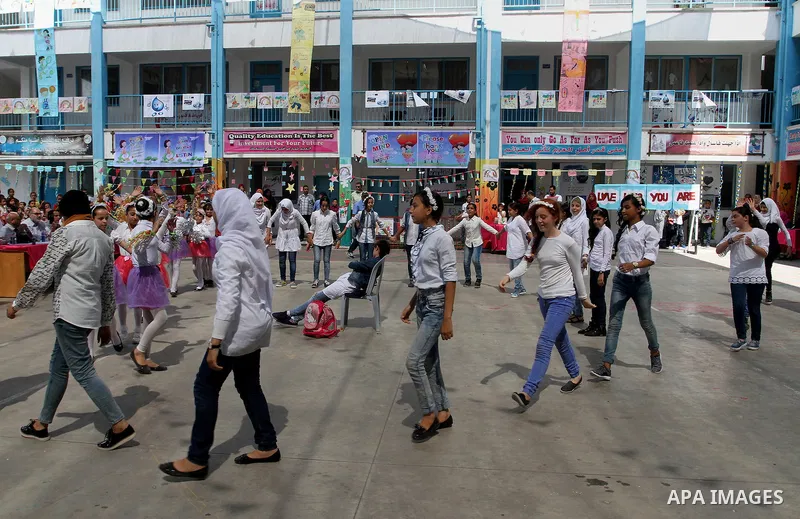 Palestinian schoolgirls take part in the closing ceremony of 2016 summer fun week organised by the United Nations Relief and Works Agency (UNRWA), in Rafah in the southern Gaza strip, on August 10, 2016. Photo by Abed Ra...