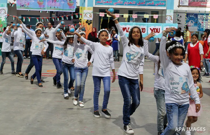 Palestinian schoolgirls take part in the closing ceremony of 2016 summer fun week organised by the United Nations Relief and Works Agency (UNRWA), in Rafah in the southern Gaza strip, on August 10, 2016. Photo by Abed Ra...