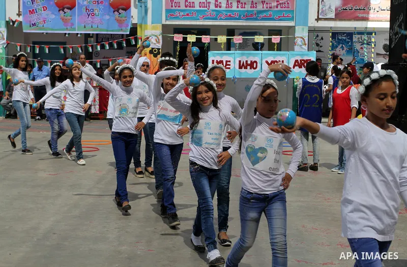 Palestinian schoolgirls take part in the closing ceremony of 2016 summer fun week organised by the United Nations Relief and Works Agency (UNRWA), in Rafah in the southern Gaza strip, on August 10, 2016. Photo by Abed Ra...