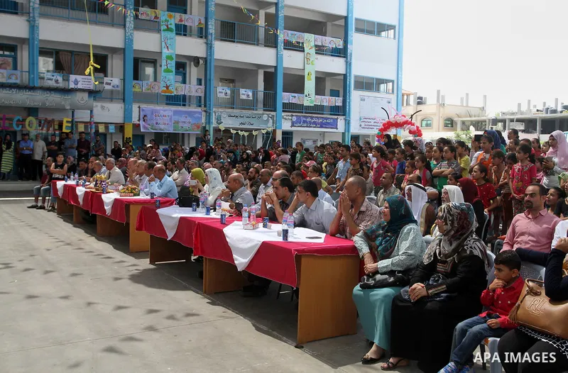 Palestinian schoolgirls take part in the closing ceremony of 2016 summer fun week organised by the United Nations Relief and Works Agency (UNRWA), in Rafah in the southern Gaza strip, on August 10, 2016. Photo by Abed Ra...