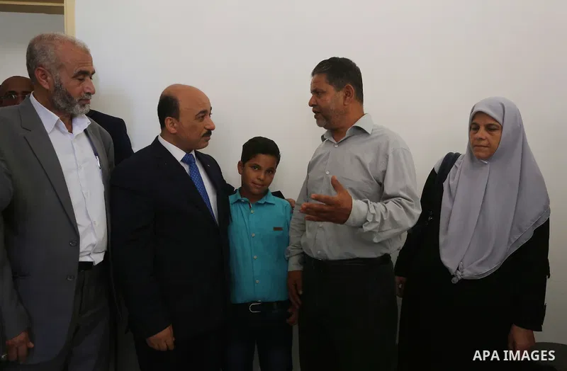 Palestinian Minister of public works and housing, Mofeed al-Hasayna, attends the distribution ceremony the 40 housing units funded by the Saudi Fund for the Palestinians, whose house was destroyed by what witnesses said...