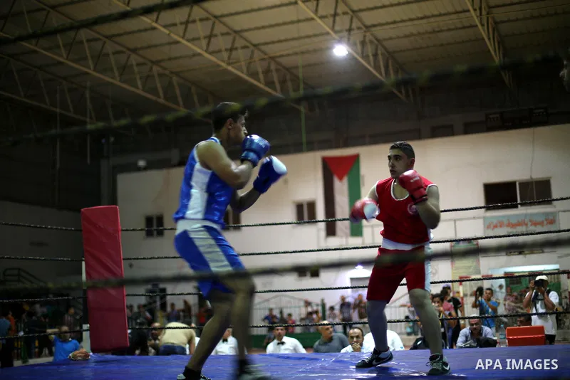 Palestinian players participate in a boxing match of the late Muhammad Ali in Gaza city, on August 12, 2016. Photo by Mohammed Asad