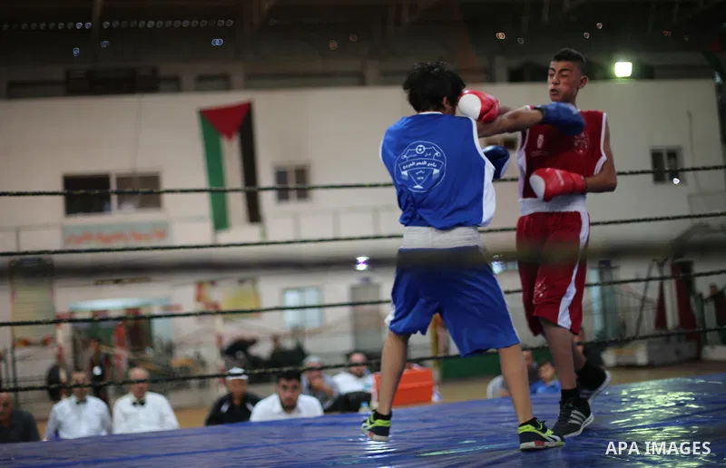 Palestinian players participate in a boxing match of the late Muhammad Ali in Gaza city, on August 12, 2016. Photo by Mohammed Asad