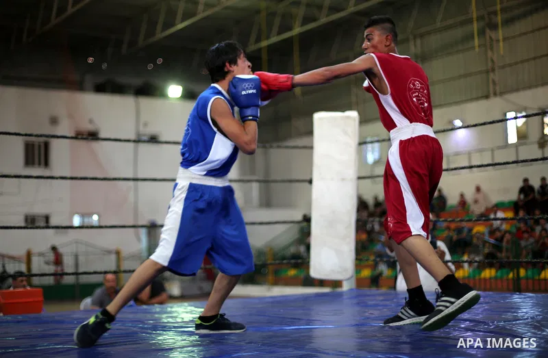 Palestinian players participate in a boxing match of the late Muhammad Ali in Gaza city, on August 12, 2016. Photo by Mohammed Asad