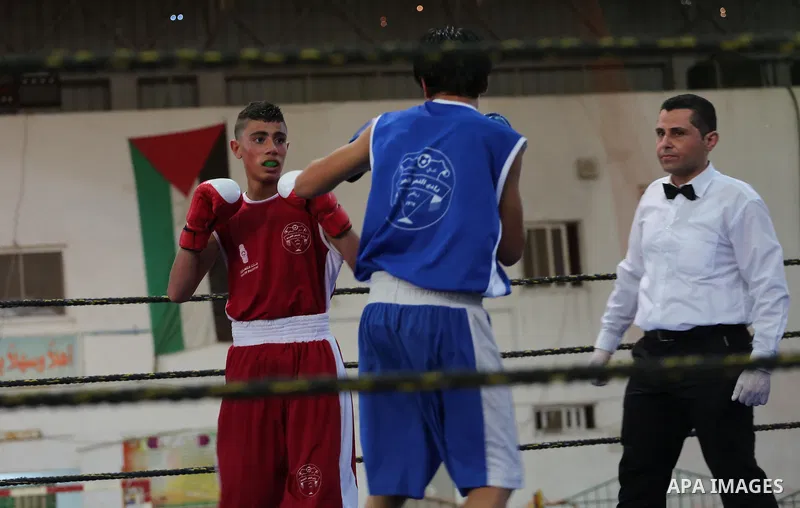 Palestinian players participate in a boxing match of the late Muhammad Ali in Gaza city, on August 12, 2016. Photo by Mohammed Asad