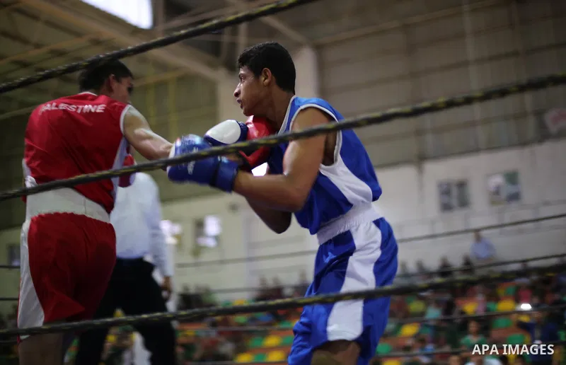 Palestinian players participate in a boxing match of the late Muhammad Ali in Gaza city, on August 12, 2016. Photo by Mohammed Asad