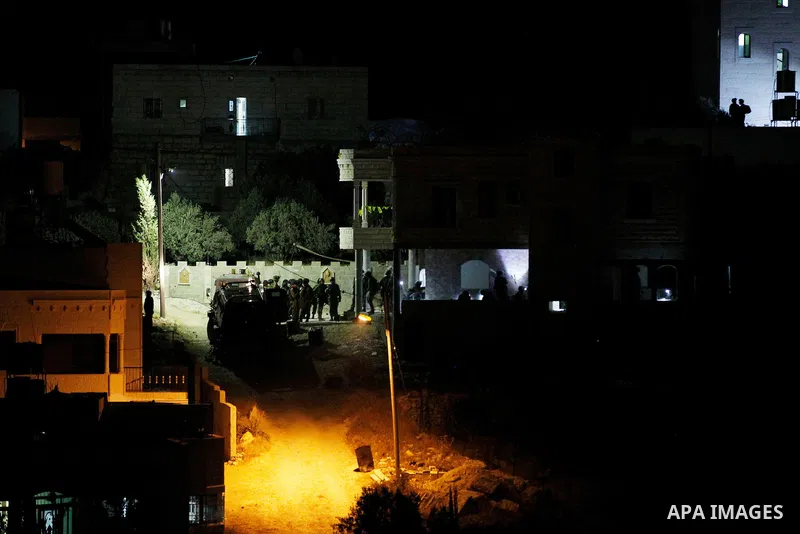 Israeli soldiers set explosives to partially blow up the family house of Palestinian assailant Mohammad Tarayra in the West Bank village of Bani Naem, east of Hebron August 15, 2016. Photo by Wisam Hashlamoun