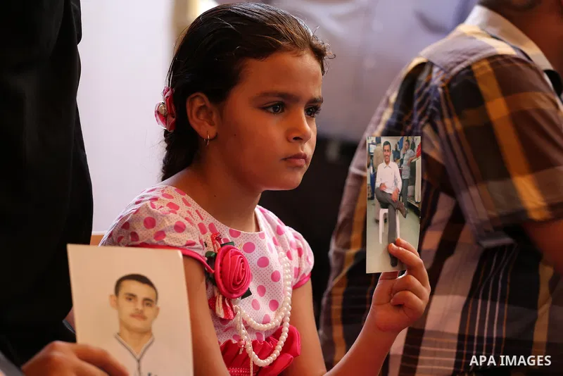 Palestinians take part in a protest demanding release the prisoners in Israeli jails, in front of Red cross office, in Gaza city on August 15, 2016. Photo by Mohammed Asad
