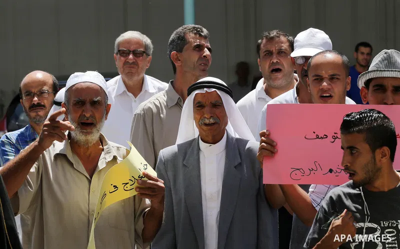 Palestinians from the Al-Bureij refugee camp, take part in protest demanding their rights, in Gaza city, on August 16, 2016. Photo by Mohammed Asad