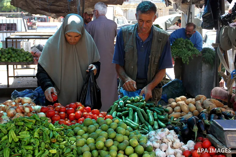Palestinians shop at a market in Rafah in the southern Gaza strip, on August 16, 2016. Photo by Abed Rahim Khatib