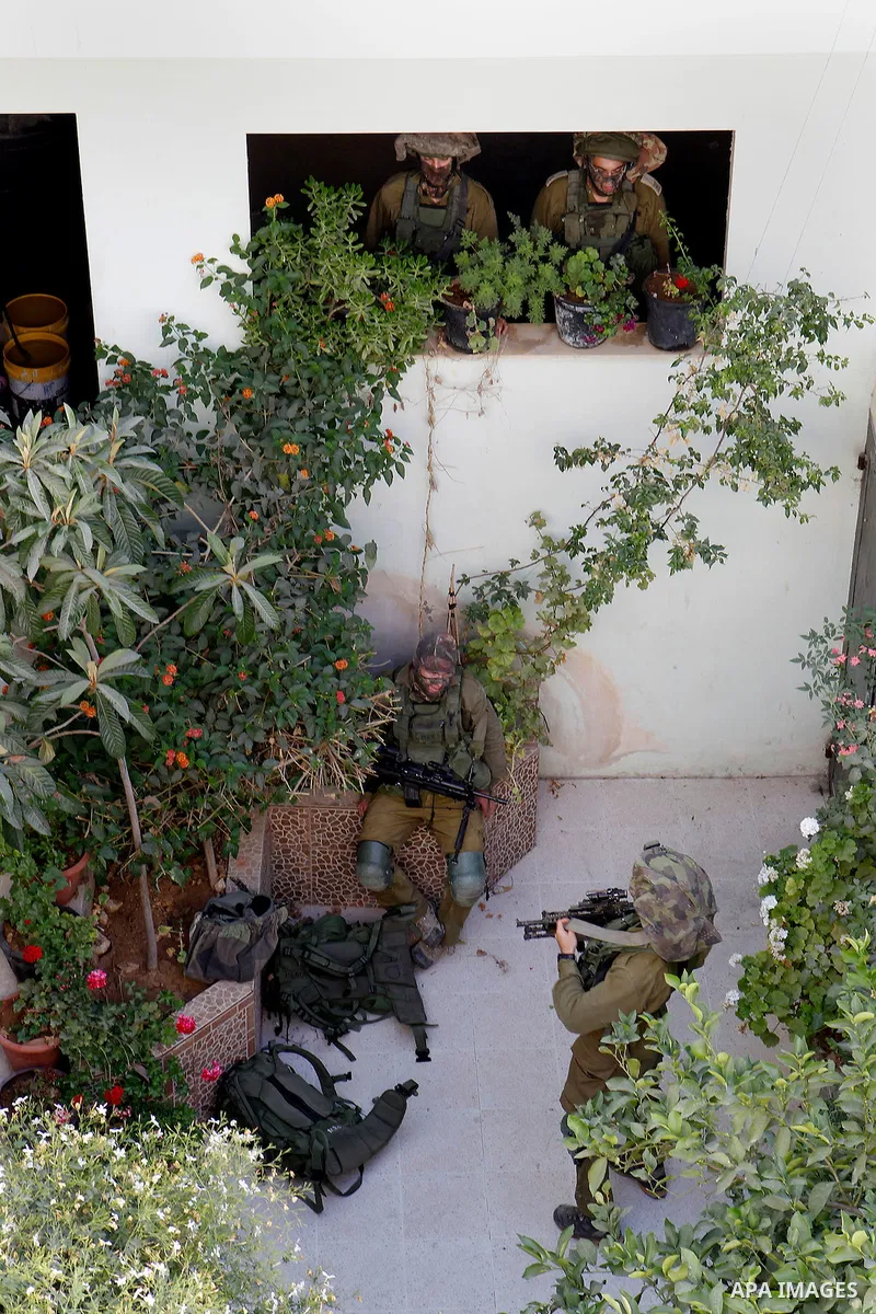 Israeli soldiers conduct searches in the Palestinian al-Fawwar refugee camp, south of the West Bank city of Hebron, on August 16, 2016. Twenty-five Palestinians were wounded in clashes with Israeli soldiers conducting se...