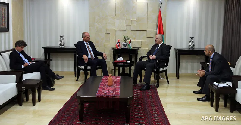 Palestinian Prime Minister Rami Hamdallah meets with the representative of Norway to the Palestine Hans Jacob in the West Bank city of Ramallah, on Aug. 17, 2016. Photo by Prime Minister Office