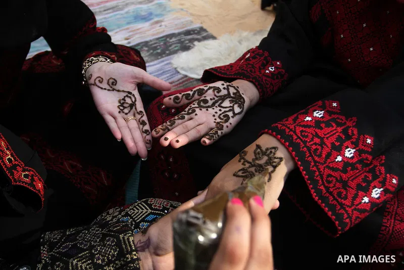 Palestinians take part in heritage festival during the closing ceremony of 2016 summer fun week organised by the United Nations Relief and Works Agency (UNRWA), in Khan Younis in the southern Gaza strip, on August 17, 20...