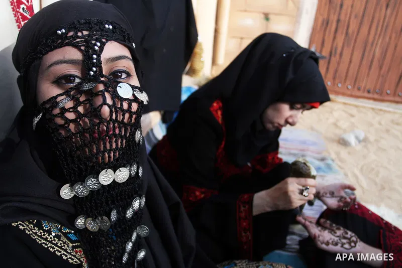 Palestinians take part in heritage festival during the closing ceremony of 2016 summer fun week organised by the United Nations Relief and Works Agency (UNRWA), in Khan Younis in the southern Gaza strip, on August 17, 20...