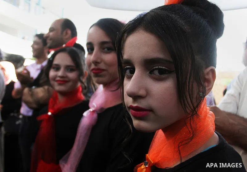 Palestinians take part in heritage festival during the closing ceremony of 2016 summer fun week organised by the United Nations Relief and Works Agency (UNRWA), in Khan Younis in the southern Gaza strip, on August 17, 20...