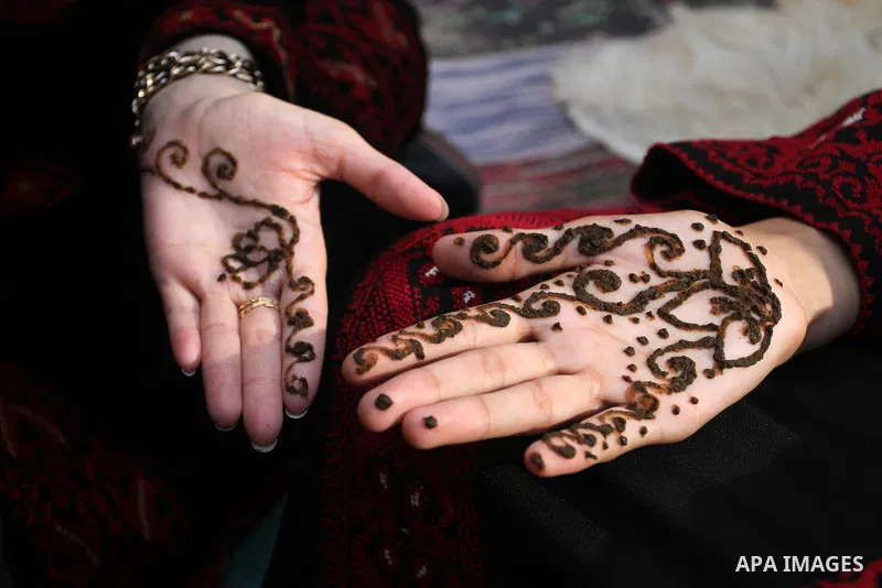 Palestinians take part in heritage festival during the closing ceremony of 2016 summer fun week organised by the United Nations Relief and Works Agency (UNRWA), in Khan Younis in the southern Gaza strip, on August 17, 20...