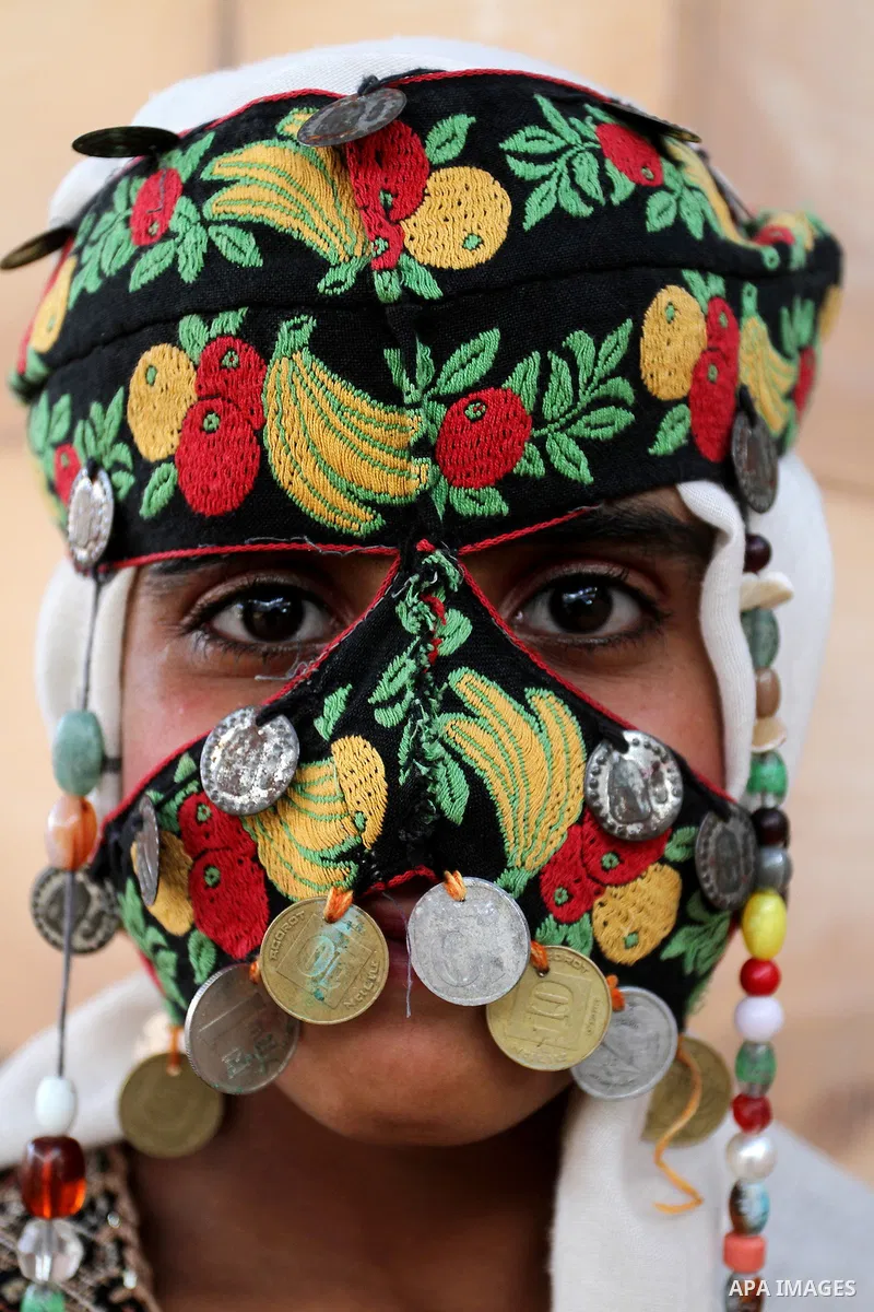 Palestinians take part in heritage festival during the closing ceremony of 2016 summer fun week organised by the United Nations Relief and Works Agency (UNRWA), in Khan Younis in the southern Gaza strip, on August 17, 20...