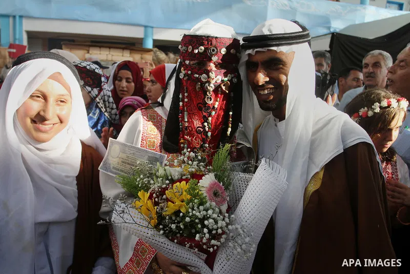 Palestinians take part in heritage festival during the closing ceremony of 2016 summer fun week organised by the United Nations Relief and Works Agency (UNRWA), in Khan Younis in the southern Gaza strip, on August 17, 20...